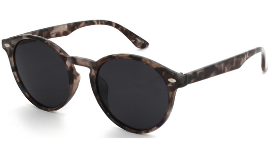 Sunglasses with tortoiseshell frame and dark lenses on a white background